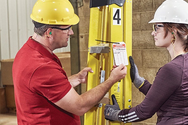 Factory Manager Talking to Employee
